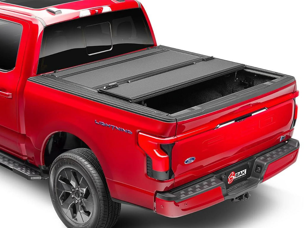 by RealTruck BAKFlip  Hard Folding Truck Bed Tonneau Cover | 448525 | Compatible with 2017 - 2023 Nissan Titan 5' 7" Bed (67")