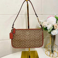 Coach  Nolita 19 In Colorblock Signature Canvas  Khaki Terracotta